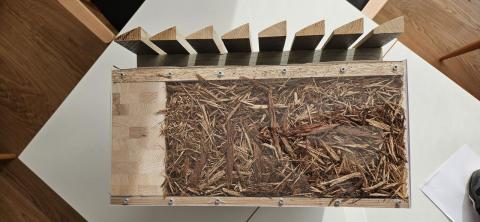 Innovative building made of wood waste