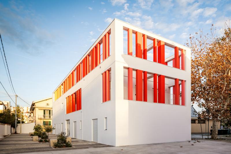 CODE-M a suspended square between houses