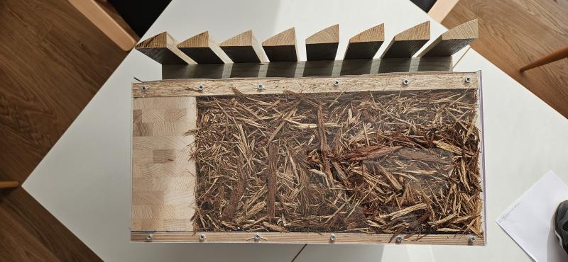 Innovative building made of wood waste